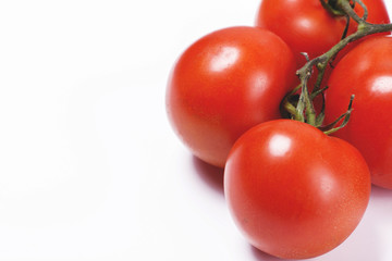 Close-up of tomatoes on white background. Copy-space.