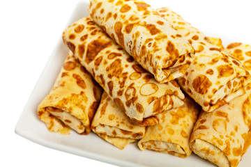 Russian Stuffed Blintzes Isolated on White. Selective focus.