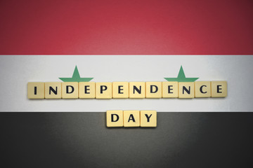 letters with text independence day on the national flag of syria.