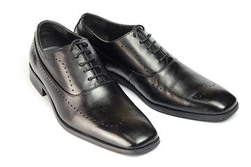 Classic black leather men's shoes isolated on white background.
