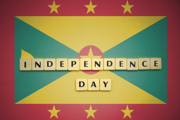 letters with text independence day on the national flag of grenada.