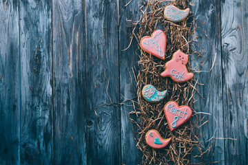 March 8. Gingerbread with taste of ginger, glazed with an inscription. Wooden blue background.
