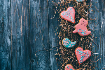 March 8. Gingerbread with taste of ginger, glazed with an inscription. Wooden blue background.