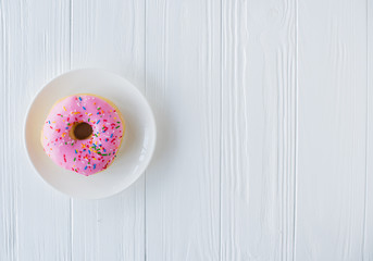 Fototapeta na wymiar One pink sweet donut
