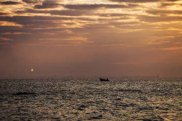 Naklejka na ściany i meble Morning fishing. Boat at sunset. Fisherman