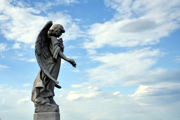Old cemetery marble sculpture of the angel.