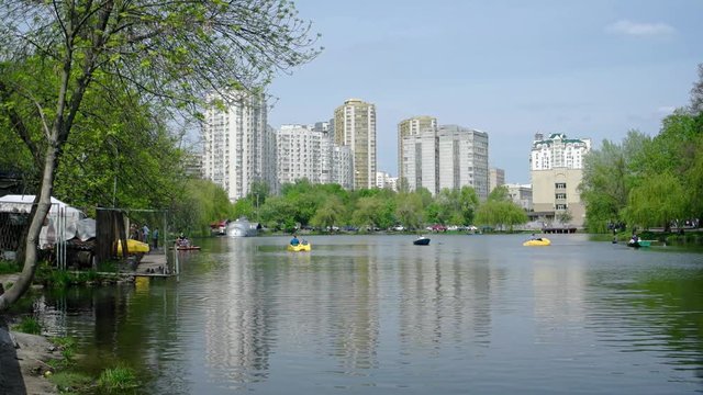 Visitors Rowing on the River at Goloseevo Park in Kiev