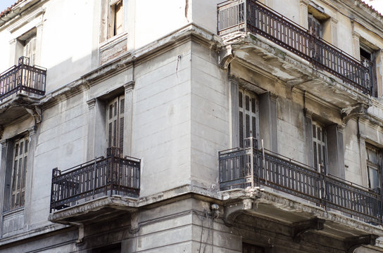 New classic house in athens first floor with crafted iron handrails, marble balconies, wooden windows viewing angle
