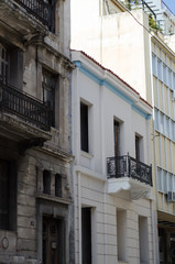 Naklejka premium New classic house in athens first floor with crafted iron handrails, marble balconies, wooden windows viewing angle