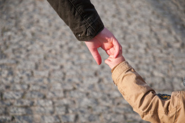 Mother and son holding hand in hand