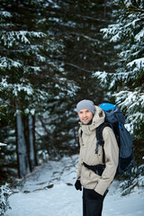 Fototapeta na wymiar hiker on the trail in the Carpathians mountains at winter