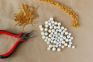 White beads, furniture and tools for making handmade jewelry