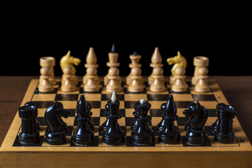 a game of chess figures are arranged on the positions of, isolated black background