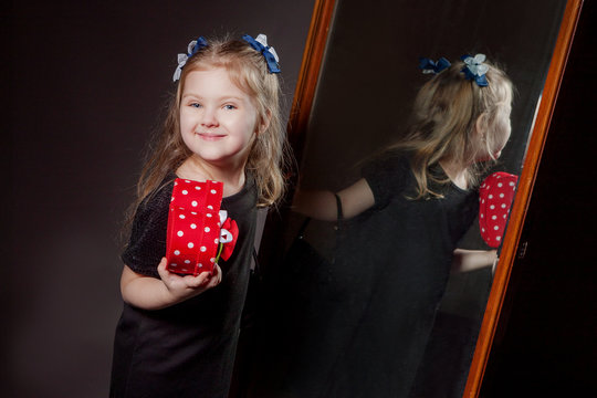 The girl in the mirror smiling