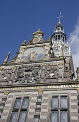 Fototapeta na wymiar old church clock tower and weigh house in Holland, The Netherlands