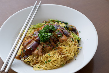 chinese noodle with sweet red pork on the table