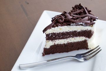 coconut cake in white plate on the dark table