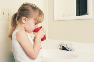 Child Rinsing Mouth out after brushing teeth