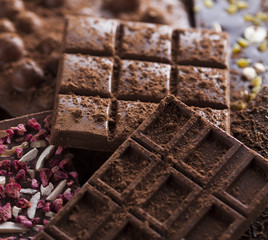 Dark and milk chocolate bar on a wooden table