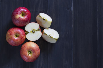 Fresh apples for health on the wooden background.