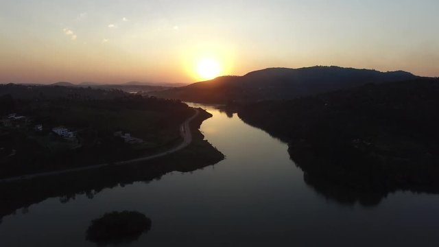 Flying over a lake on a sunrise