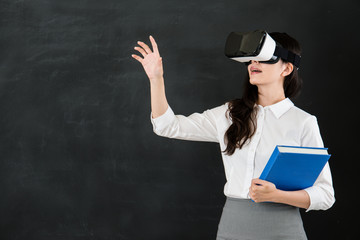 asian woman teacher touch screen with VR headset