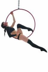 Young gymnast perfoming aerial exercise on hoop