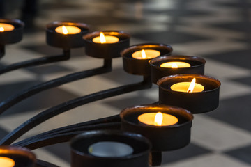 Church Prayer Candles Metal Frame Closeup Perspective Texture Religious Light Burning Yellow Flame