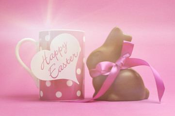 Happy Easter pink polka dot coffee mug with chocolate bunny.