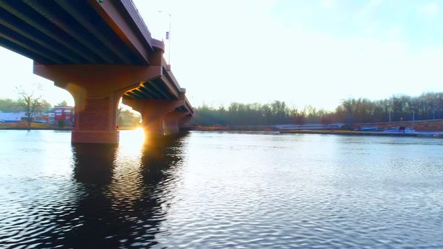 Unique aerial view of bridge from below, with amazing sunrise light. Stunning scenic with unique perspective. 