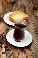 Breakfast, toast and Turkish coffee on a wooden background