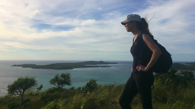 FJ 190 Young woman travels and hikes in tropical terrain