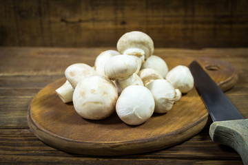 Fresh mushrooms on a wooden board