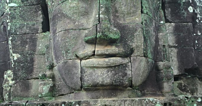 Closeup of Ancient Stone Face at Bayon Temple in Cambodia