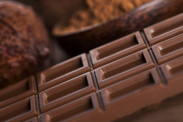 Chocolate bar, candy sweet, dessert food on wooden background