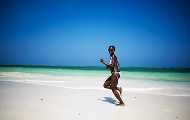 African girl running on the beach