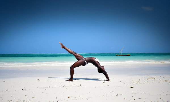 African girl beach yoga