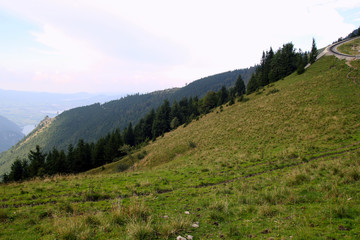 Obraz premium Travel to Sankt-Wolfgang, Austria. The road with view on the mountains and a lake.
