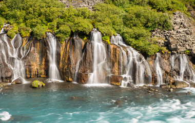 Fototapeta na wymiar Scenic lava waterfall Hraunfossar