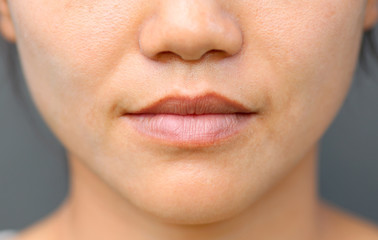 Asian girl mouth close up.