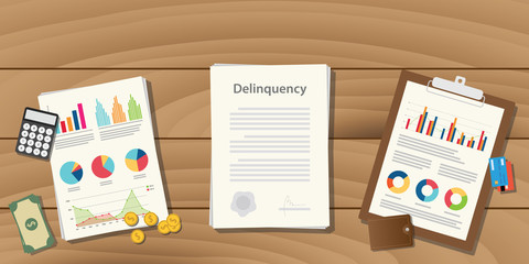 delinquency illustration concept with paperwork with graph and chart and money calculator on top of the table