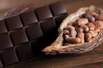 Cocoa pod and cocoa beans on the wooden table