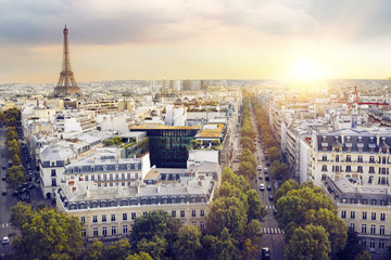 Fototapeta na wymiar Sunset Eiffel tower and Paris city view form Montparnasse. Sunset romantic background. Eiffel Tower from Champ de Mars, Paris, France.