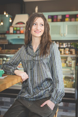 Young woman in restaurant talkin on the phone