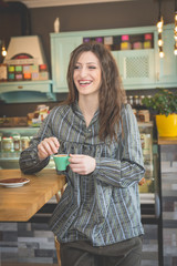 Young woman in restaurant talkin on the phone