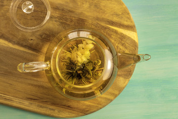 Teapot with tea flower and place for text