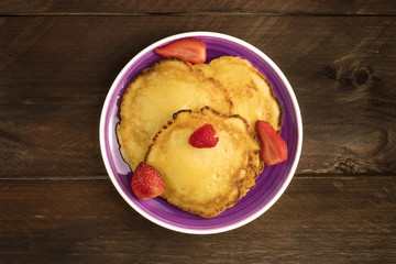 Freshly baked homemade pancakes with fresh fruit