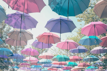 Fototapeta na wymiar Umbrella colorful floats multiple corrugated boards. Sun protection, rain and ornamental beauty.