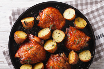BBQ Food: maple chicken thighs and baby potatoes close-up. horizontal top view