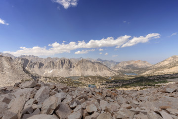 Sierra Nevada Canyon - Clouds roll over a Sierra Nevada mountain pass with a canyon down below on the pacific crest trail.
